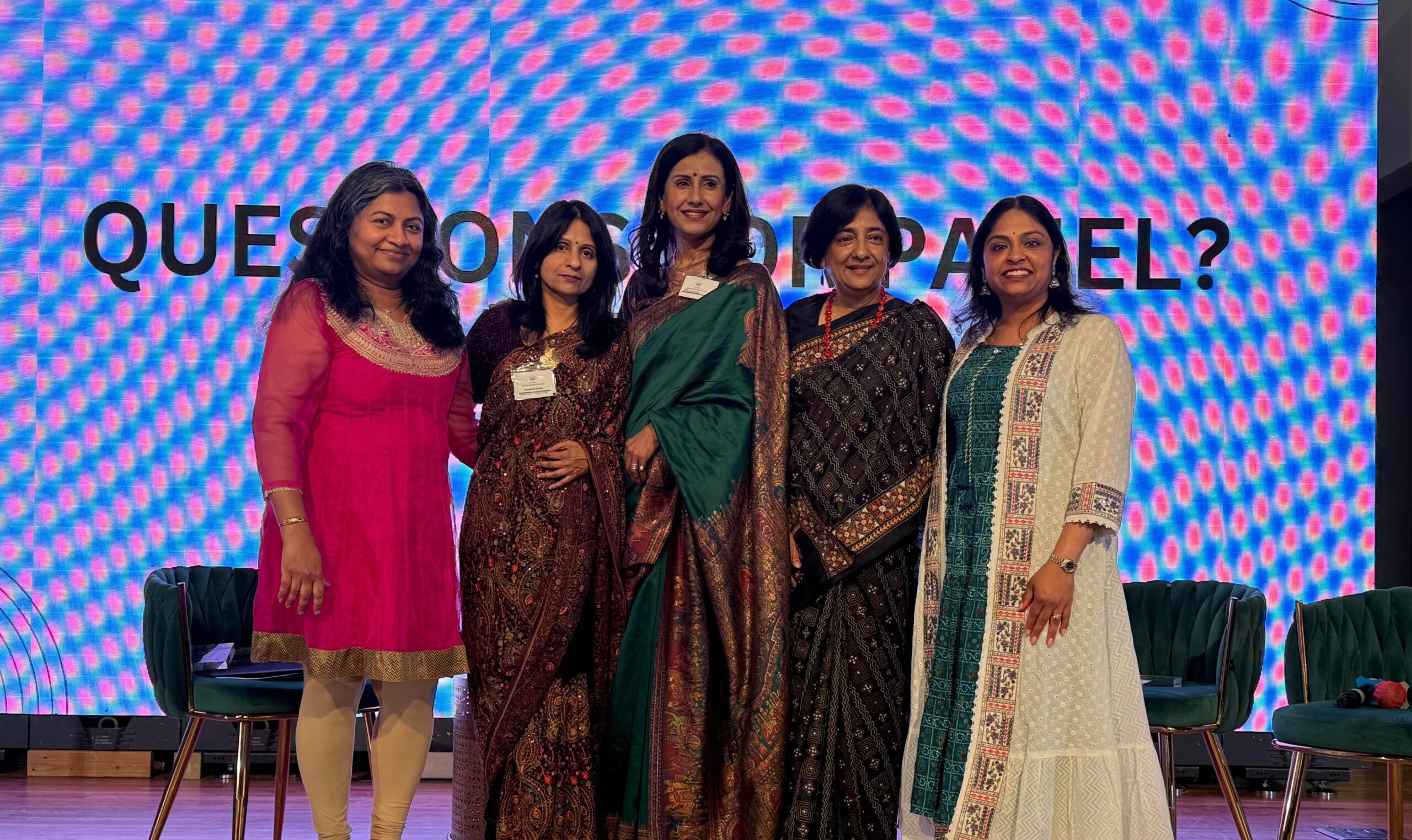 Group photo of speakers onstage at the Atlanta Indian Women’s Forum event